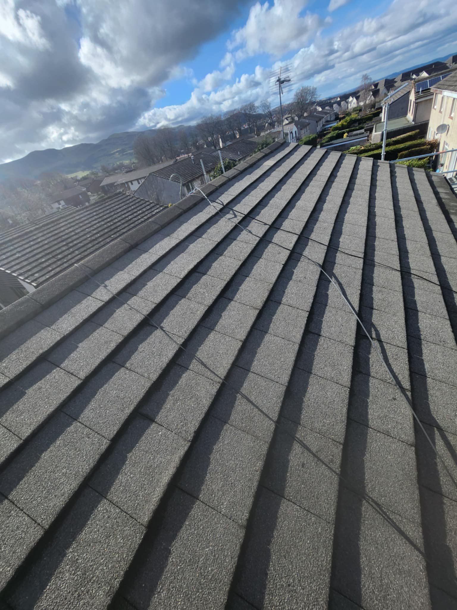 Roof cleaning in Leeds showing the results of a softwashing treatment
