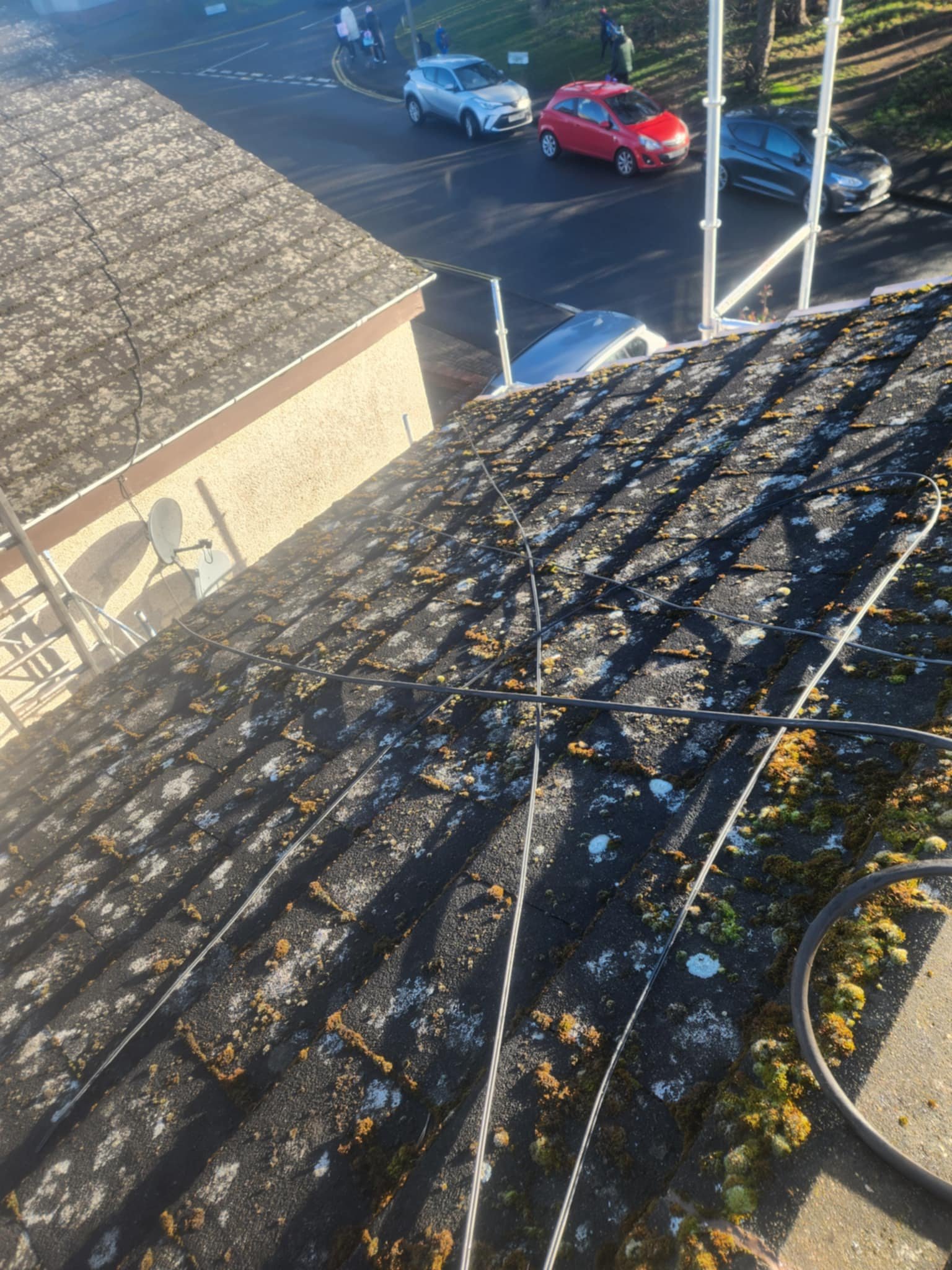 Roof cleaning of a roof covered in moss in the Harrogate area.